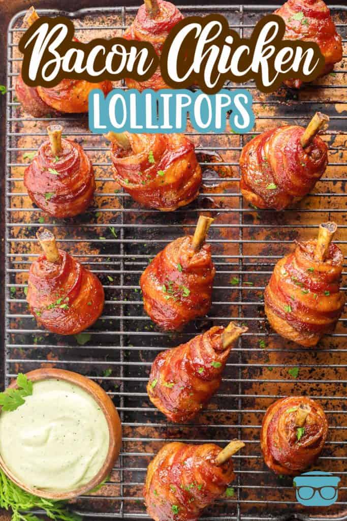 Overhead of Smoked Bacon Wrapped Chicken Lollipops on wire rack with dipping sauce