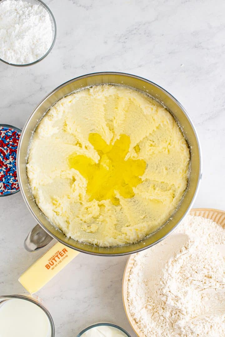 Egg whites added to bowl of stand mixer with butter