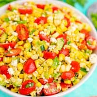 Square image close up of white bowl filled with summer corn salad