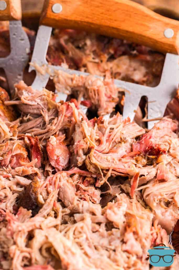 Finished Smoked Pulled Pork being shredded