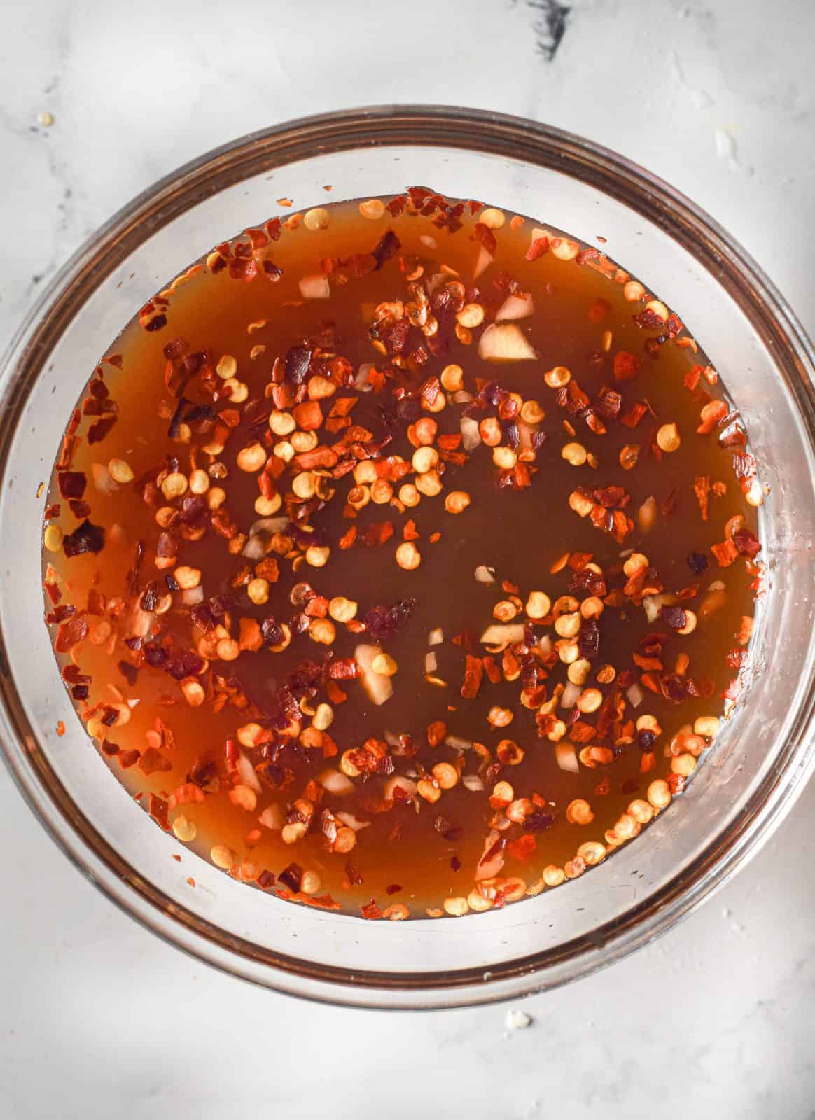 ranch sauce mixture shown in a clear bowl.
