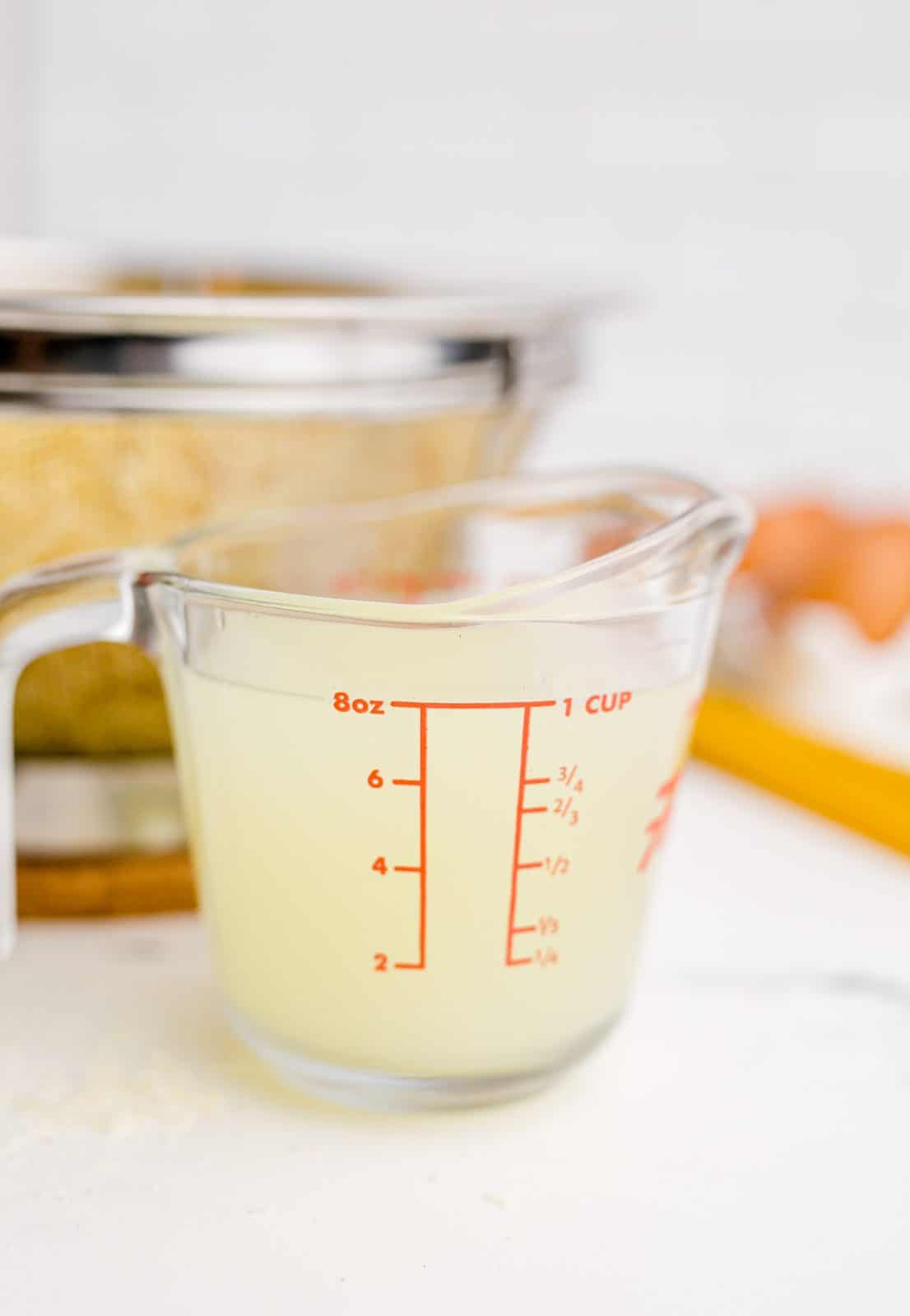 Reserved cooking water shown in a measuring cup.