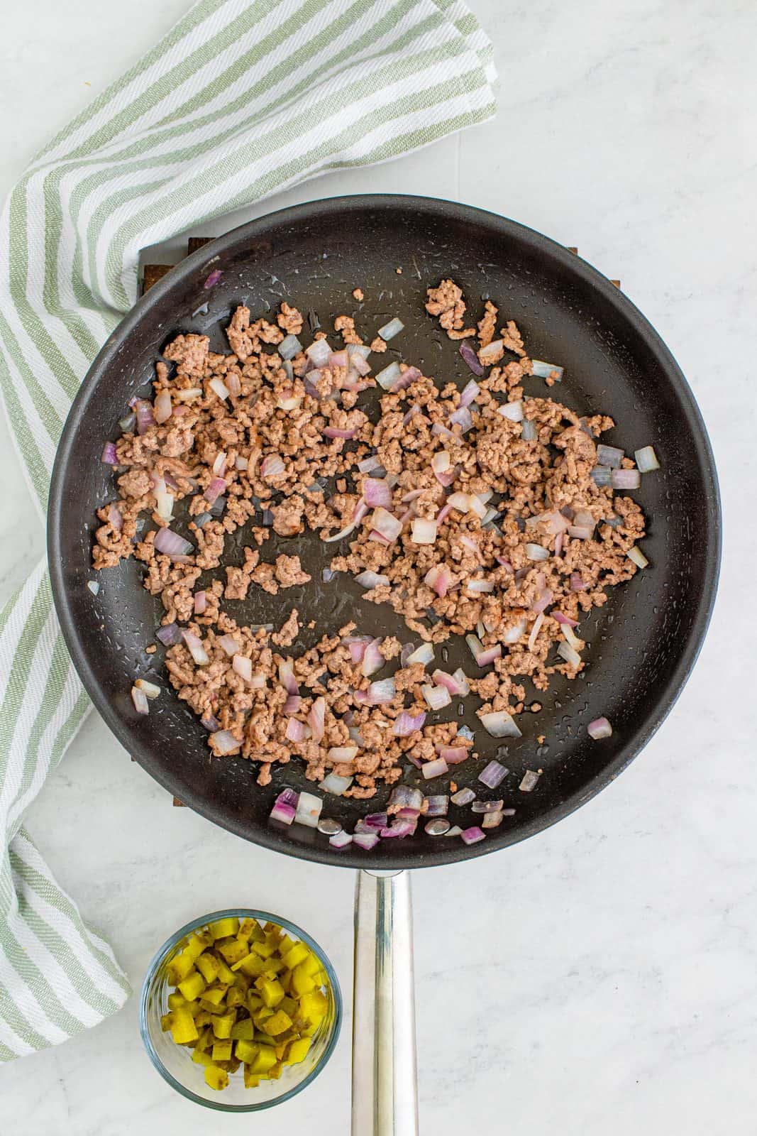 Ground beef and onions browned in pan.