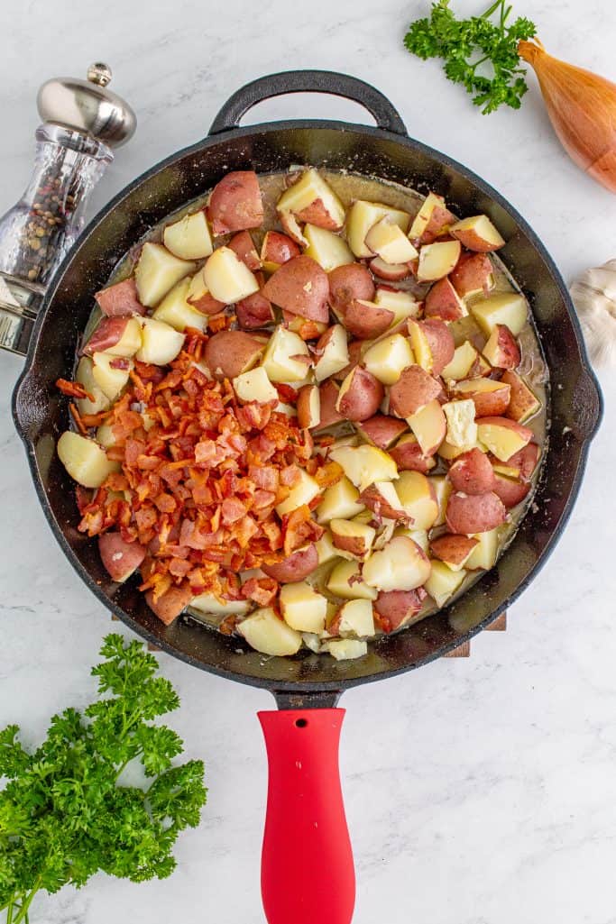 Diced potatoes and the bacon added to pan.