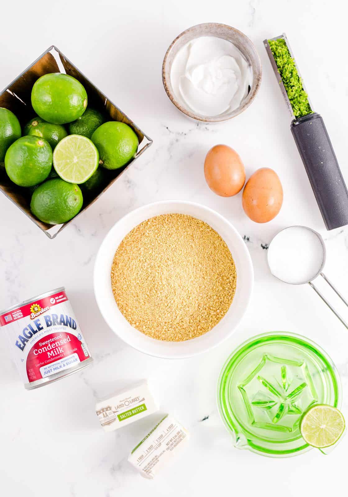 Ingredients needed: graham cracker crumbs, granulated sugar. salted butter, fresh key lime juice, key lime zest, sweetened condensed milk, sour cream and egg yolks.