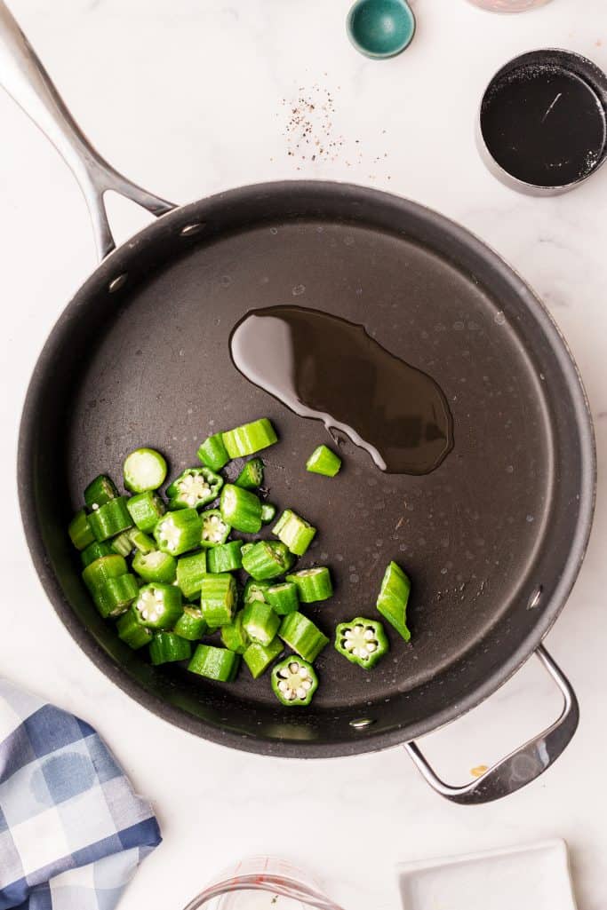 Okra added to pan with oil