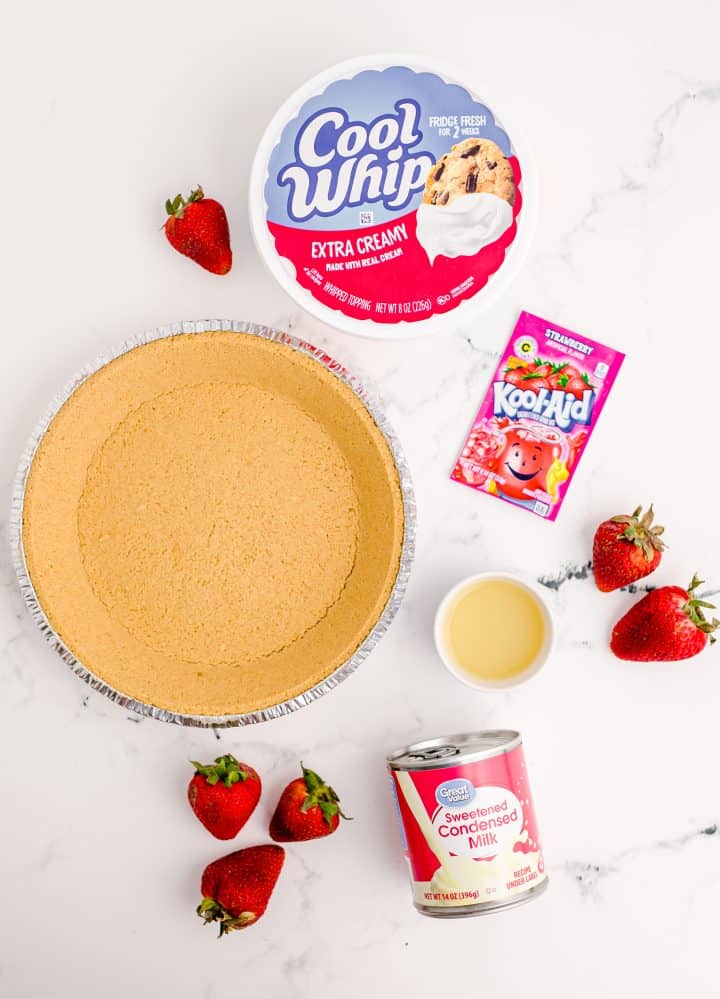 Ingredients needed to make a Strawberry Kool-Aid Pie recipe: Cool Whip, Strawberry Kool-Aid drink mix, sweetened condensed milk, lime juice and remade graham cracker crust.