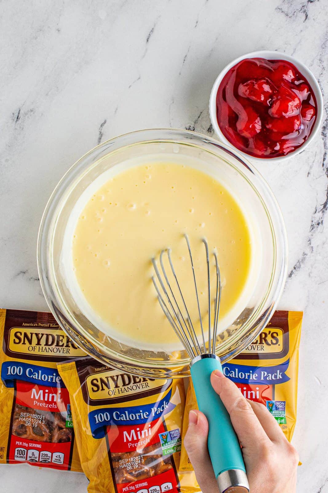 Cheesecake pudding being whisked together.