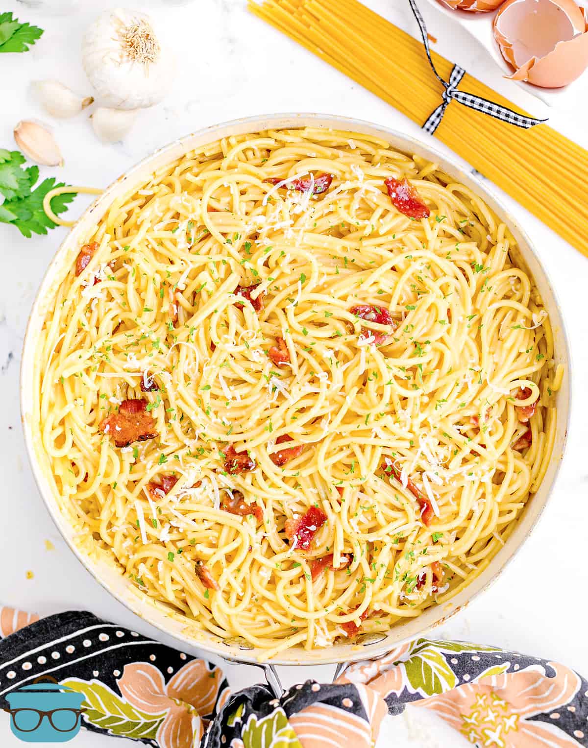 Overhead photo of Bacon Spaghetti Carbonara in a large white skillet. 