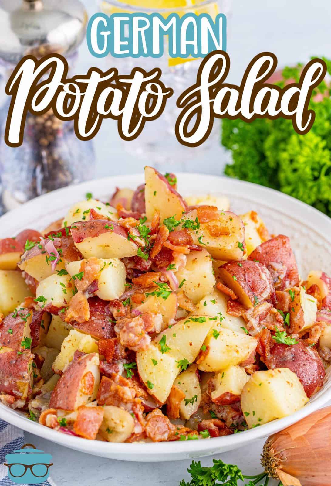 Pinterest image of German Potato Salad recipe in white bowl with parsley in background