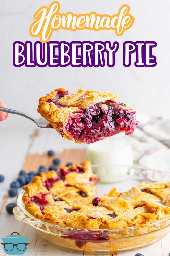 Pie server lifting a slice of Easy Homemade Blueberry Pie out of pie dish.