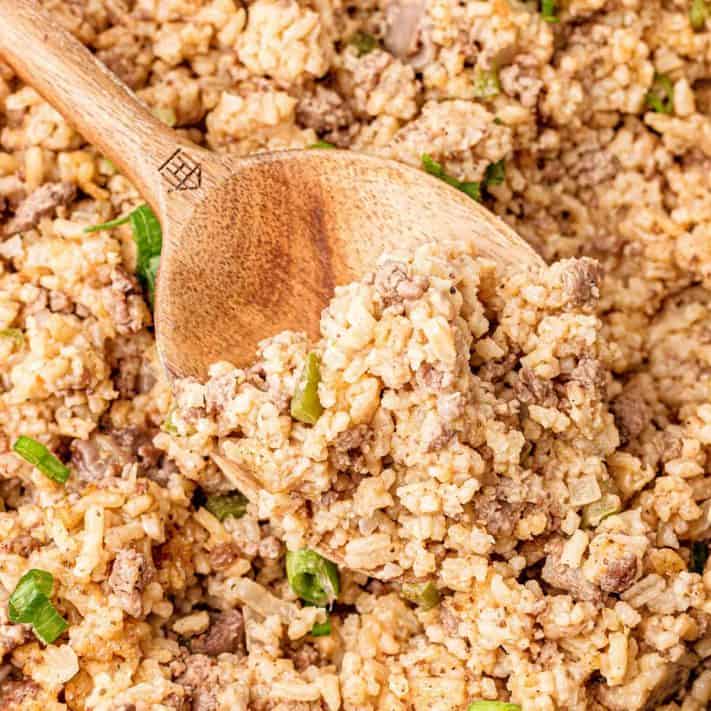 Square close up image of spoon in Dirty Rice Recipe