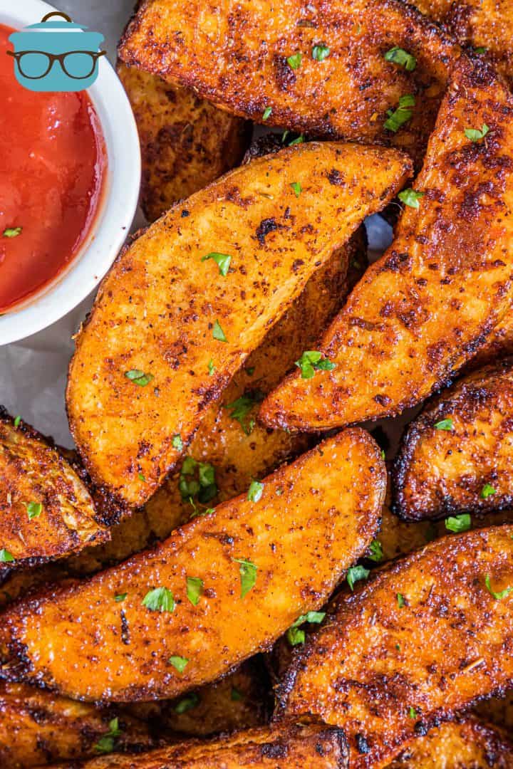 Close up of Air Fryer Potato Wedges garnished with parsley.
