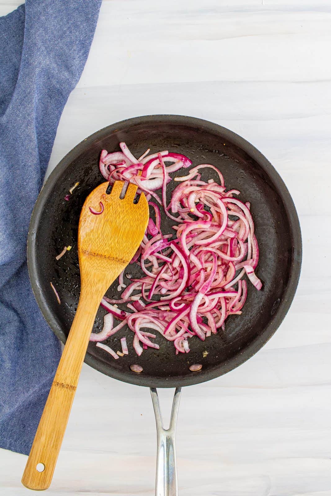 Melted butter and red onion in saute pan.
