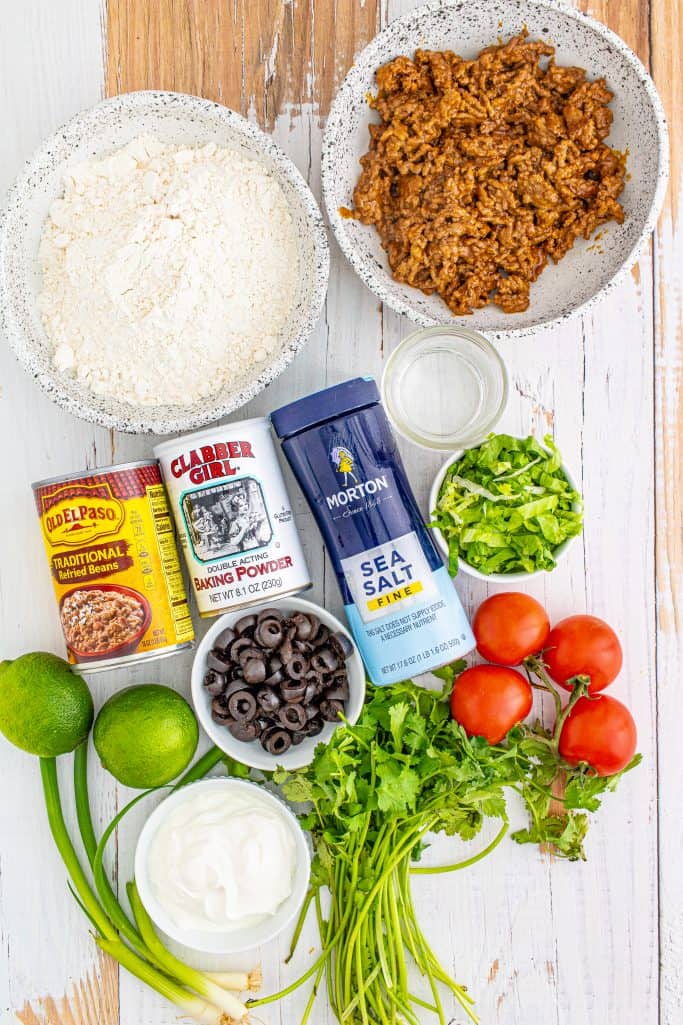 Ingredients needed: all-purpose flour, baking powder, fine sea salt, warm water, peanut oil, seasoned taco meat, refried beans and your favorite taco toppings.