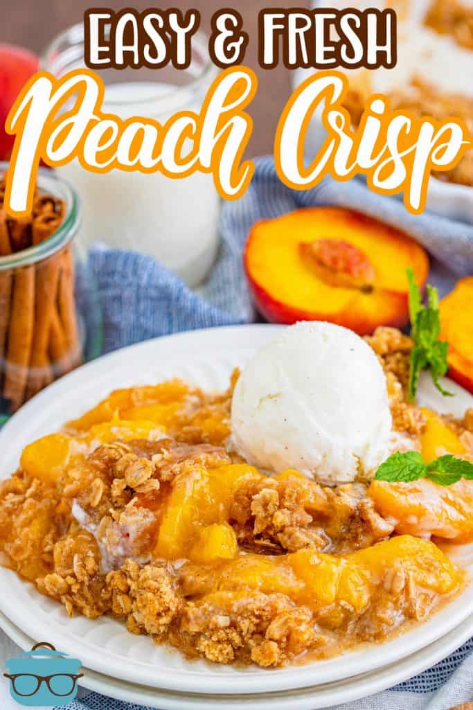 Pinterest image of Peach Crisp on plate with ice cream and mint.