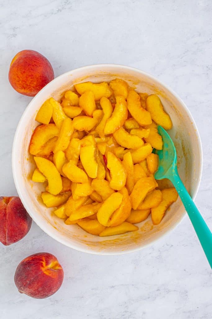Peaches added back to bowl and tossed with peach juice mixure.