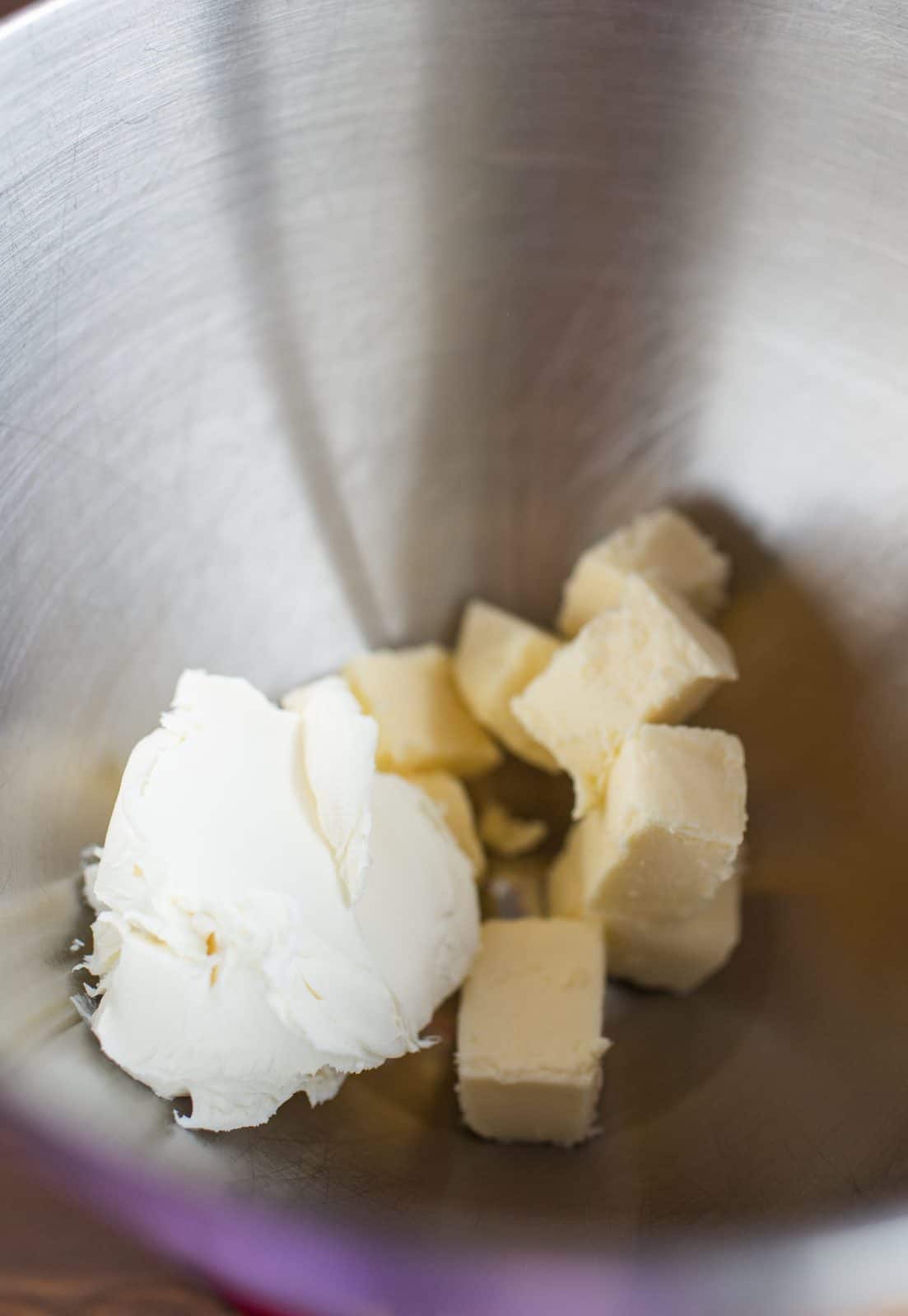 Butter, sugar and cream cheese added to bowl of stand mixer.