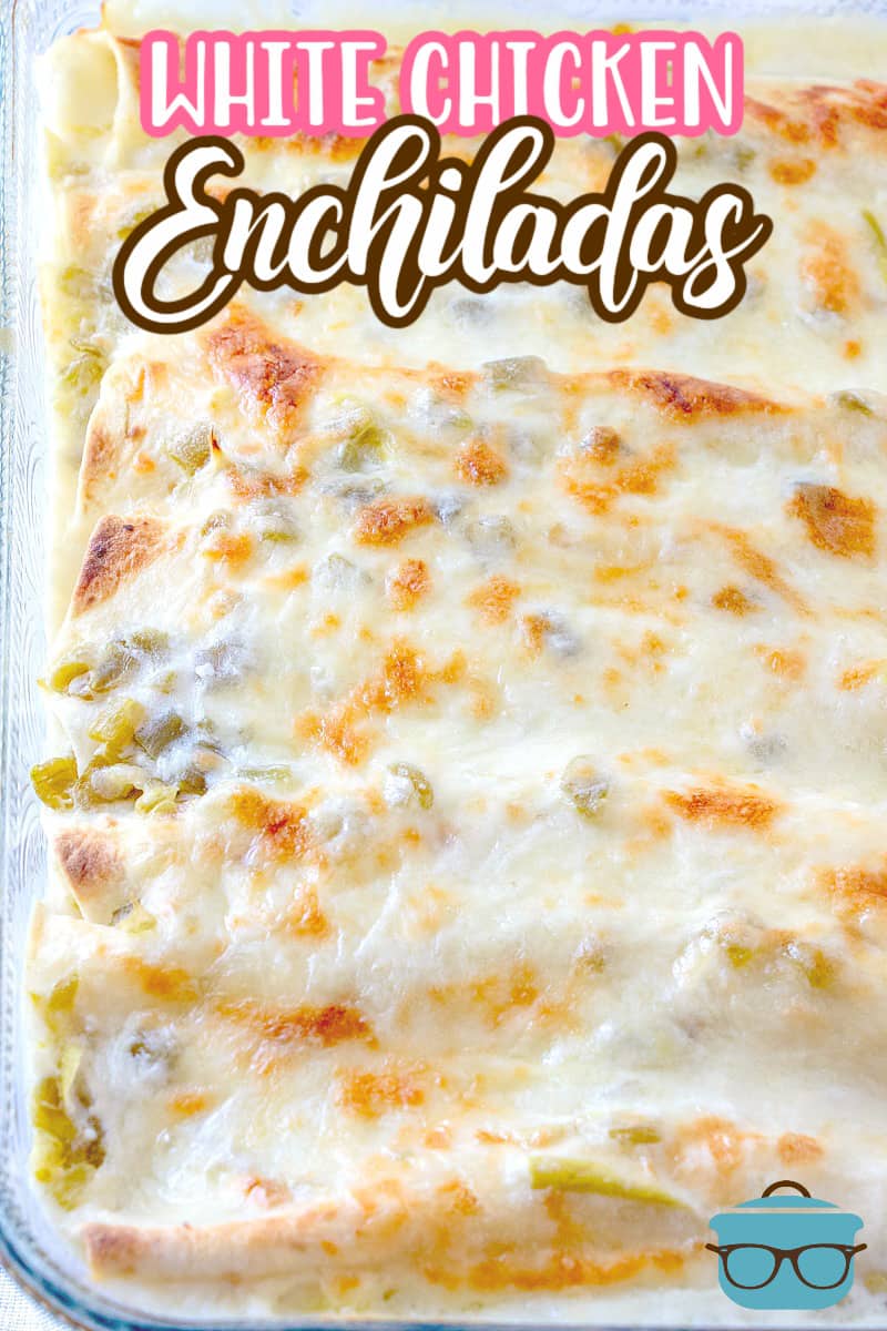 This is a photo showing White Chicken Enchiladas after baking in a clear glass balking dish. 