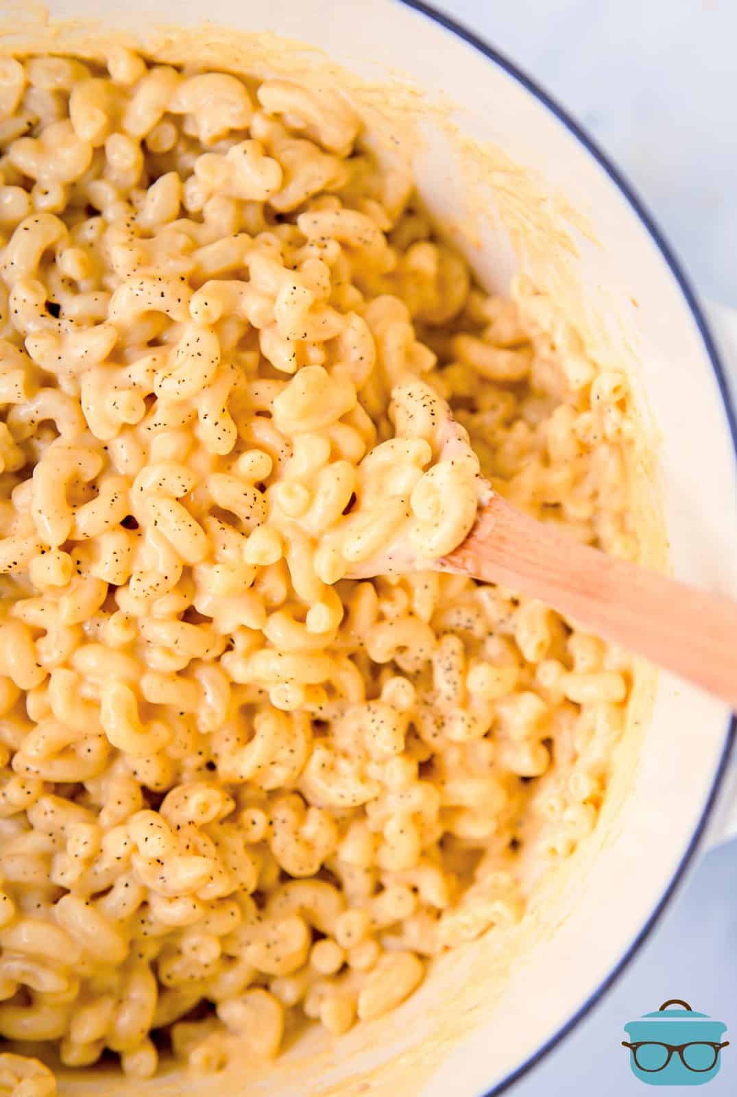 Overhead photos of Stove Top Macaroni and Cheese Recipe with wooden spooon.