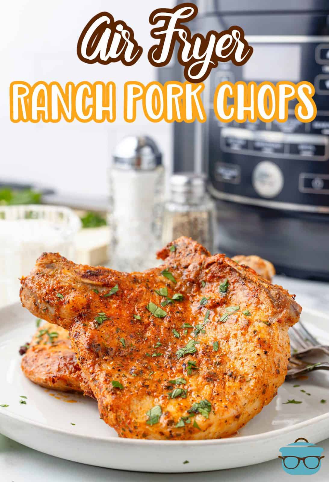 Close up of Air Fryer Ranch Pork Chops on white plate Pinterest image.
