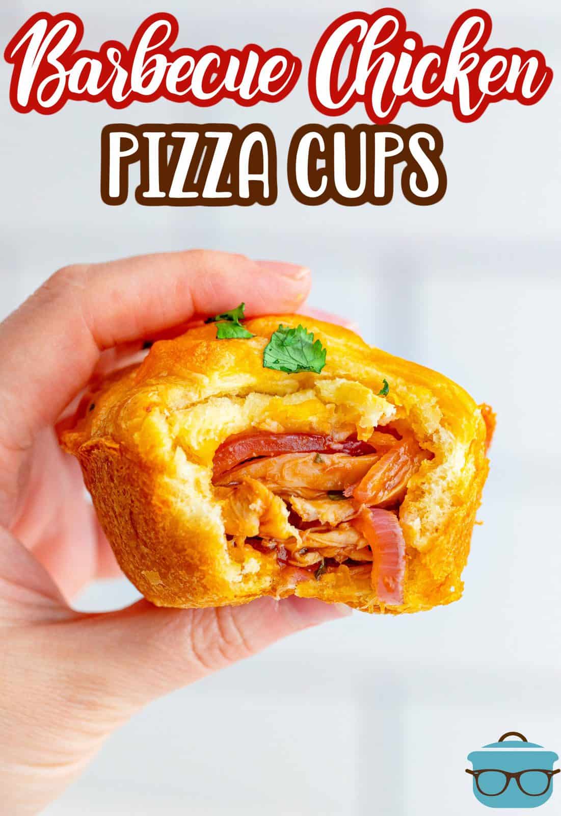 Pinterest image of hand holding one BBQ Chicken Pizza Cup with bite taken out sowing filling.