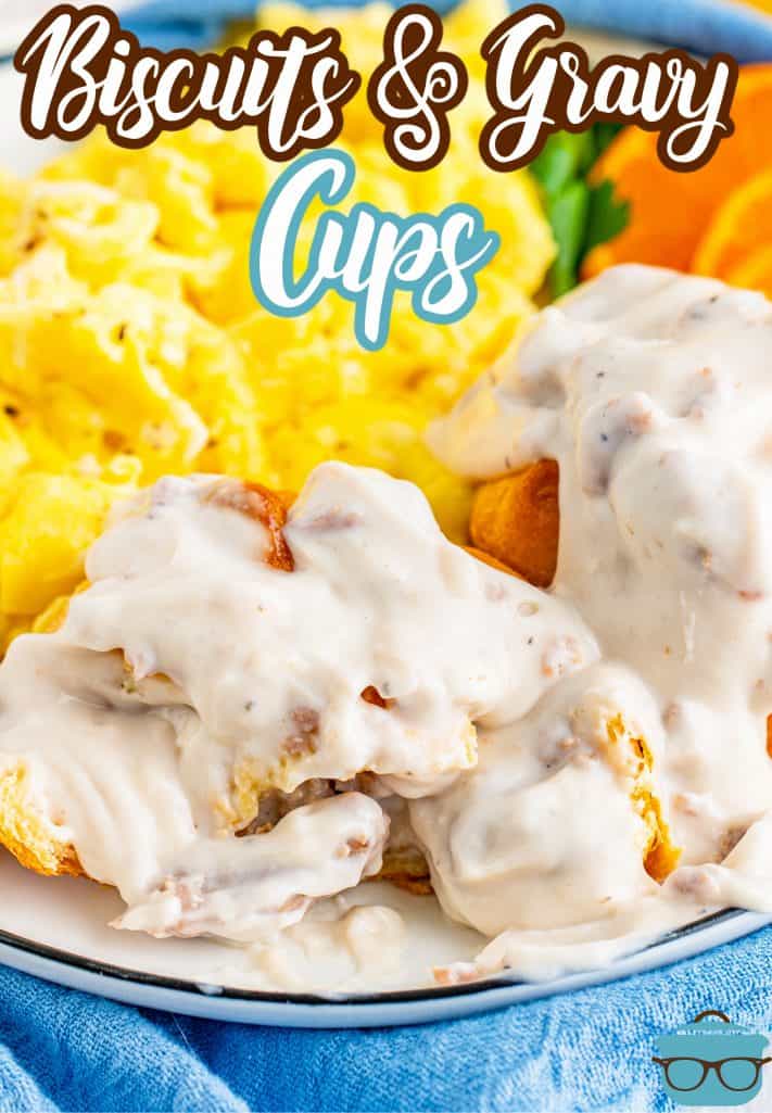 Pinterest image of Biscuits and Gravy Cup Recipe on plate with gravy, sliced opeen.