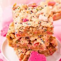 Square image side view of stacked Circus Animal Cookie Blondies.