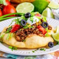 Square image of topped Fry Bread Taco.