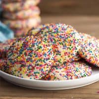 Square image of Sprinkle Cookies on white plate.