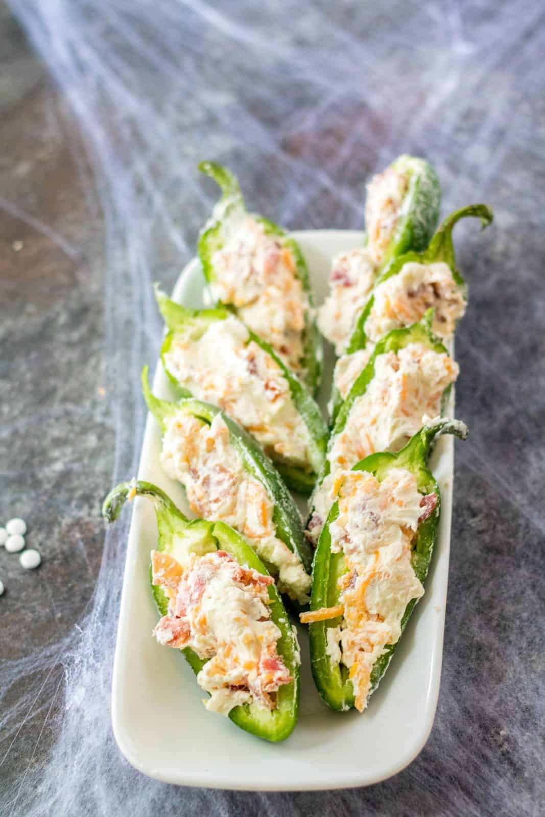 Sliced jalapenos filled with cheese and bacon mixture.