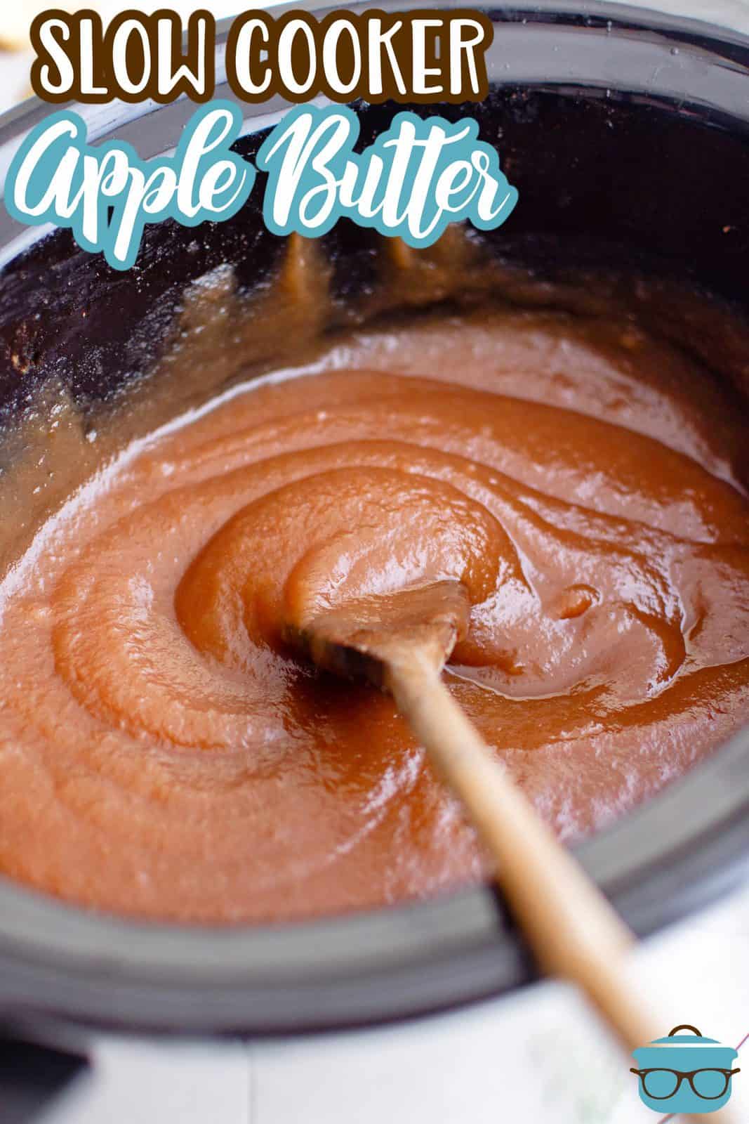 Pinterest image of Slow Cooker Apple Butter in slow cooker with wooden spoon.