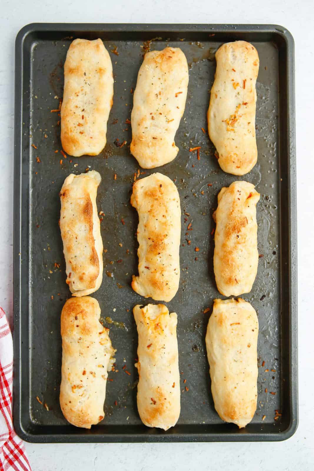 Baked Pepperoni Roll Breadsticks on baking sheet.