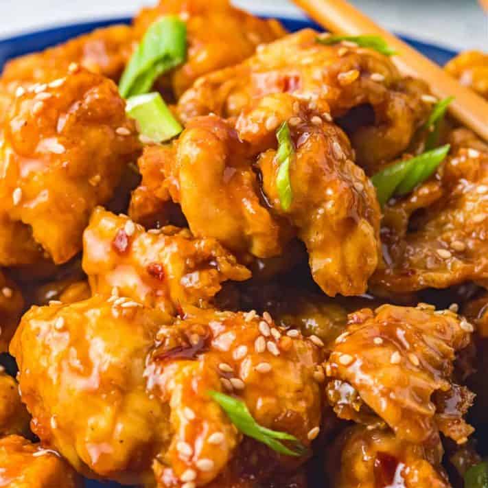 Square image of finished and garnished General Tso's Chicken.