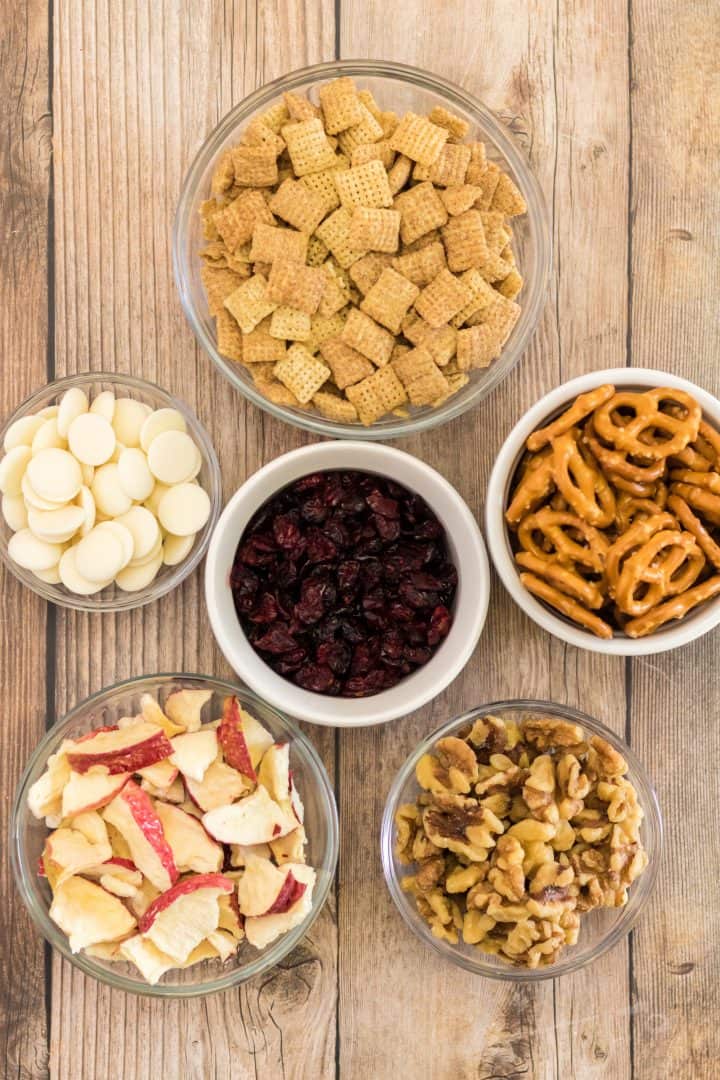 Ingredients needed: cinnamon chex mix, mini pretzels, dried apple chips, walnuts, dried cranberries and white chocolate chips.
