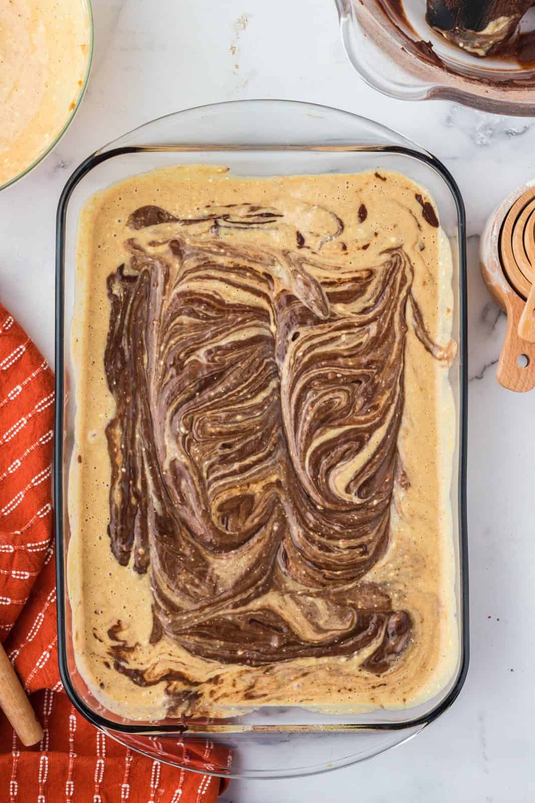 Pumpkin layer and remaining brownie batter added to pan and swirled together.