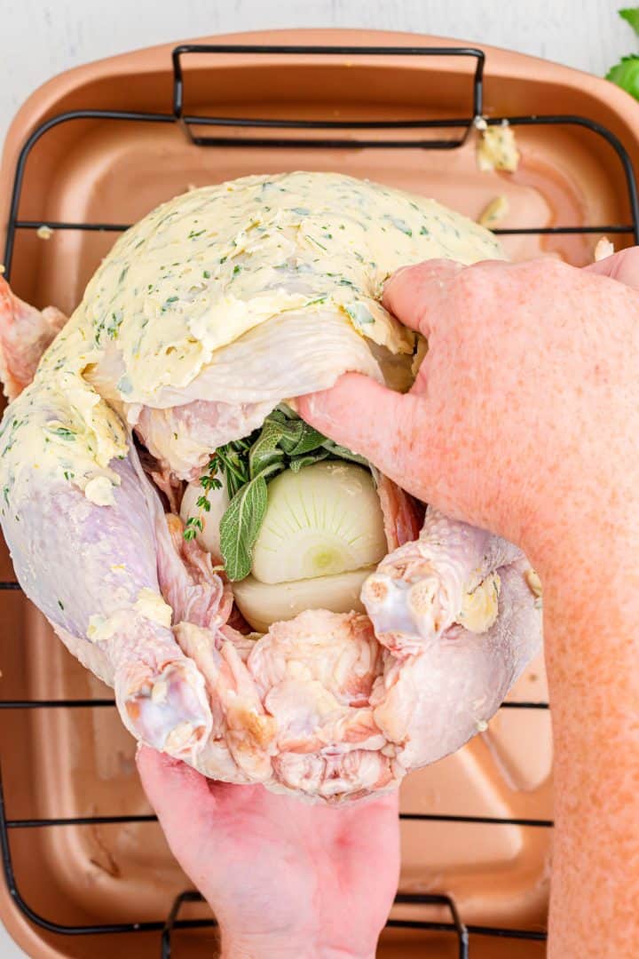 Butter rubbed turkey stuffed with emon halves, onion halves, herbs and garlic cloves.