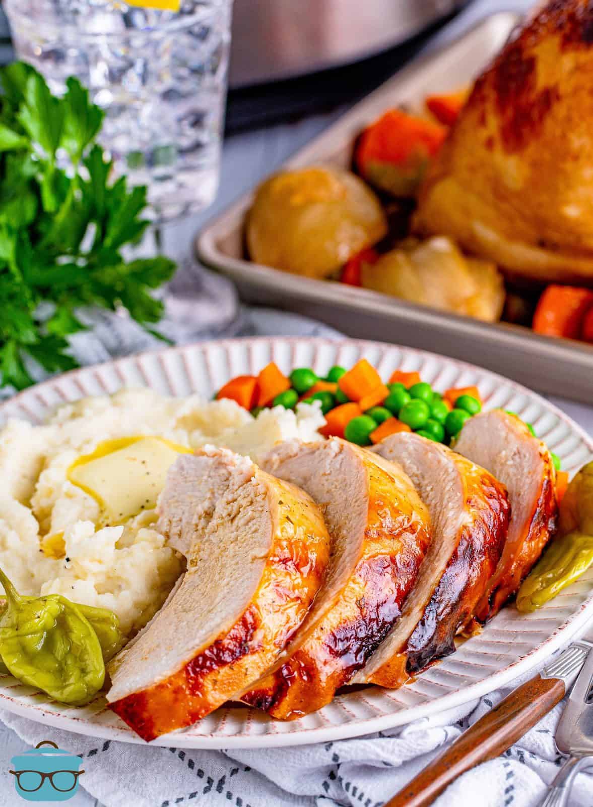 Sliced and plated Crock Pot Mississippi Turkey Breast with vegetables and potatoesl