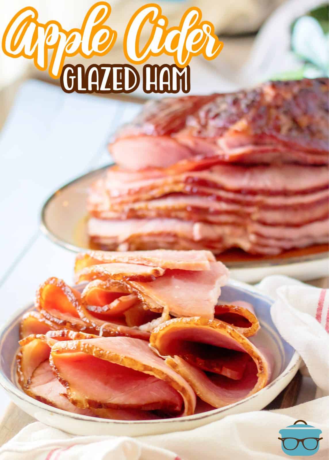 Pinterest image with sliced Apple Cider Glazed Ham on plate with whole ham in background on platter.