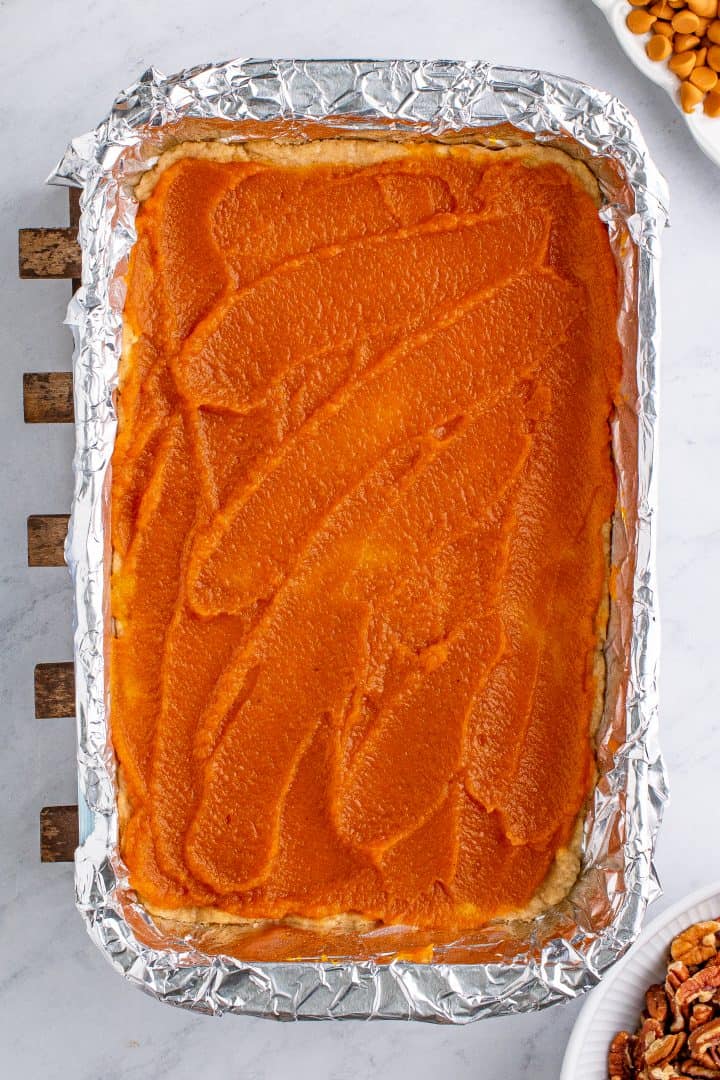 Pumpkin pie filling spread over crust.