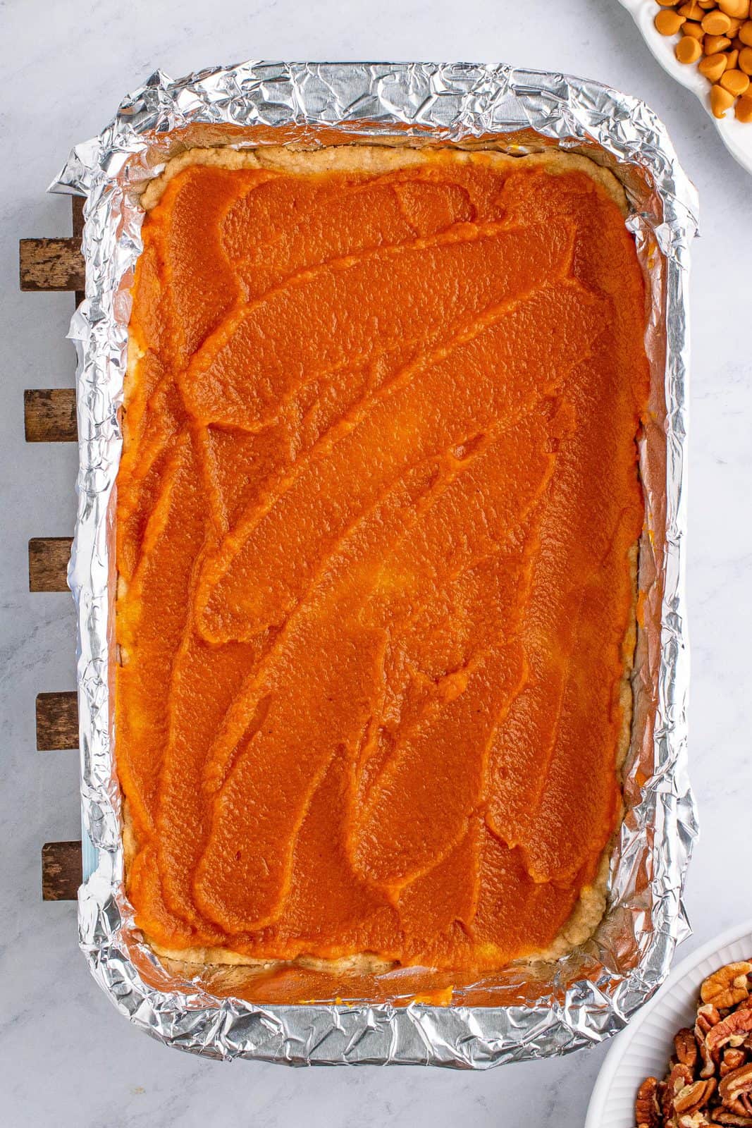 Pumpkin pie filling spread over crust.