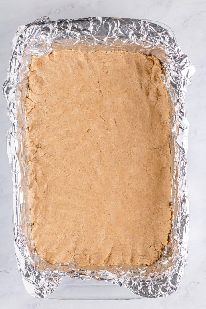 Crust mixture pressed into foil lined pan.