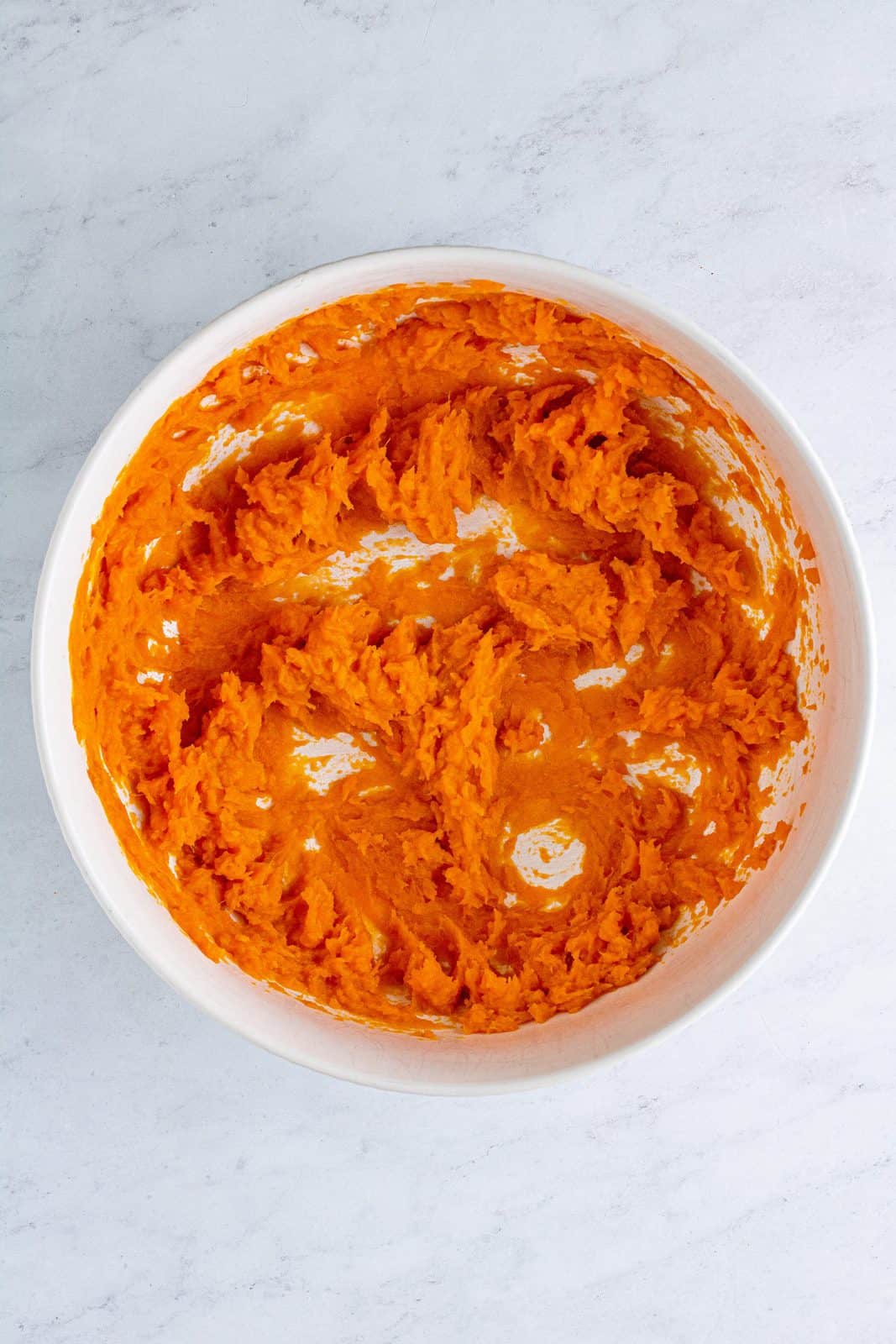 Sweet potatoes blended in bowl.