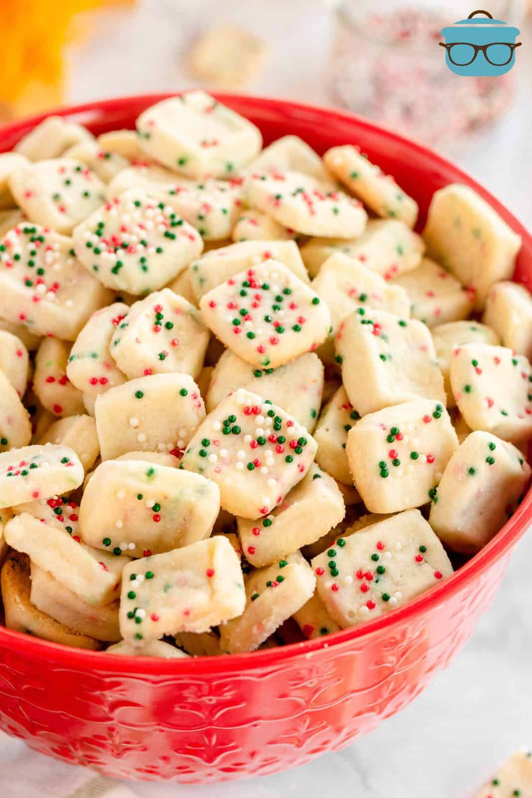 Mini Christmas Shortbread Cookies in red bowl.
