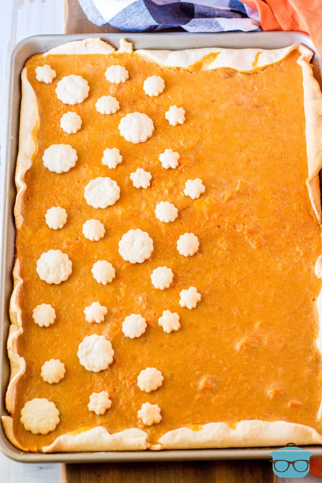Finished Sweet Potato Slab Pie in pan with pie crust decorations.