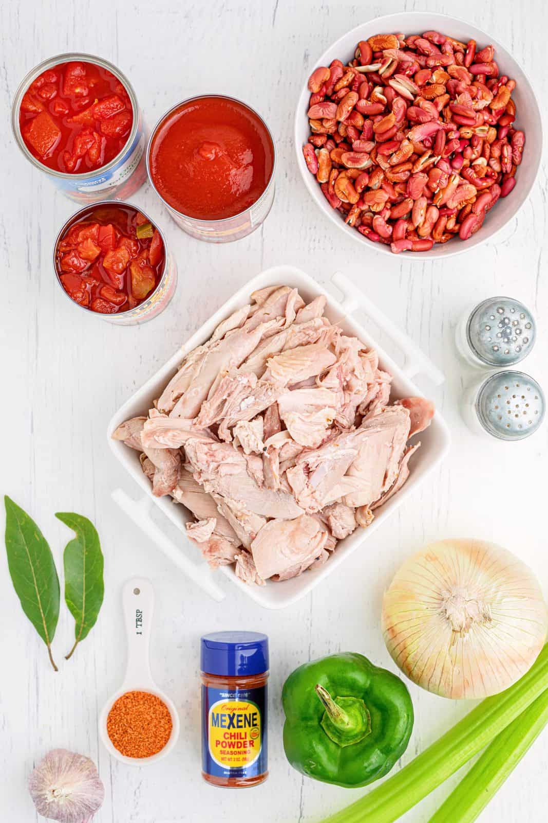 Ingredients needed: leftover roast turkey, dry red kidney beans, chopped tomatoes and chiles, tomato sauce, chopped tomatoes, yellow onions, green bell pepper, celery ribs, garlic, bay leaves, creole seasoning, Mexene Chili Seasoning mix, salt and pepper.