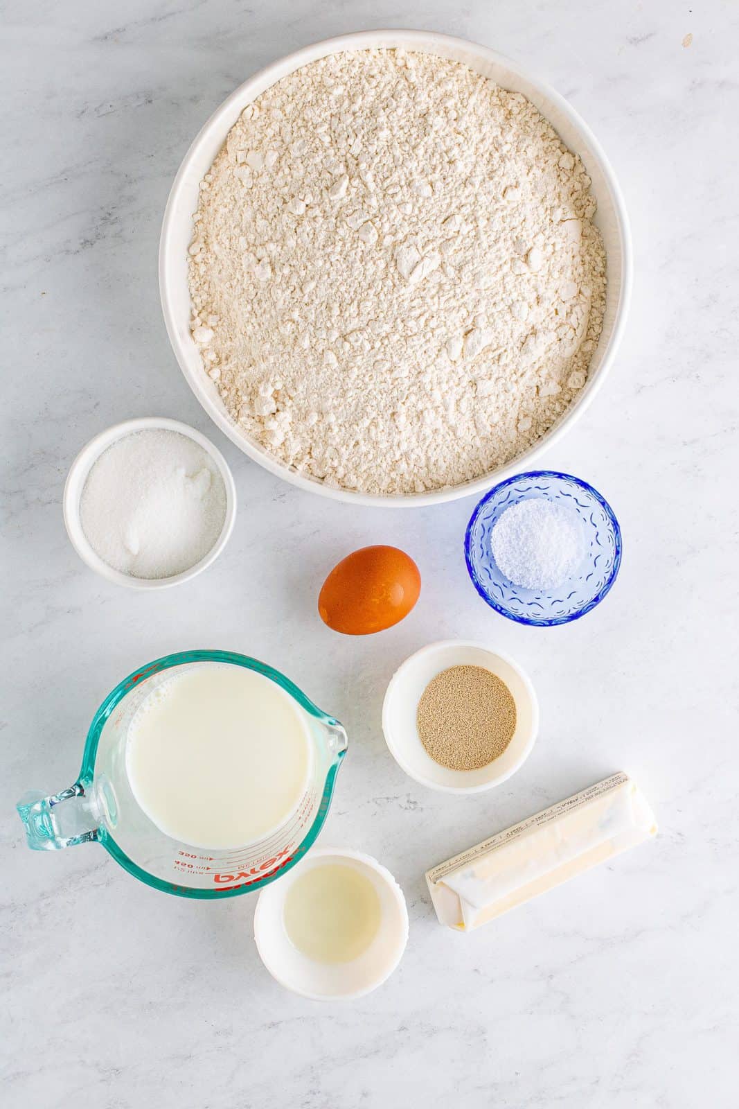 Ingredients needed: unsalted butter, granulated sugar, kosher salt, whole milk, active dry yeast, egg, 3 ½ to 4 cups all-purpose flour and vegetable oil.