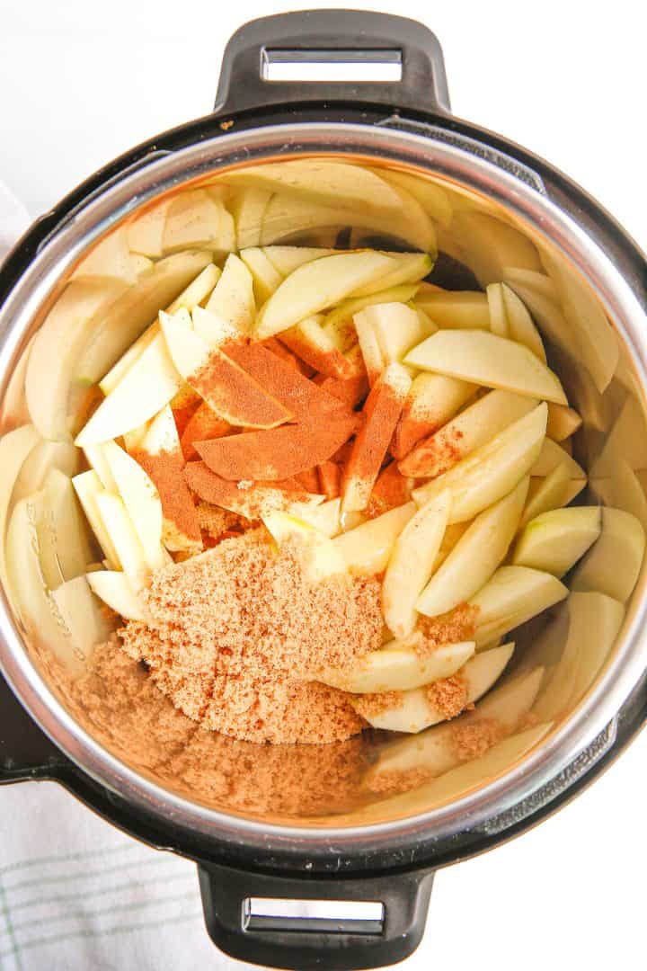 Apples in instant pot with brown sugar, cinnamon, nutmeg, honey, cornstarch and water.