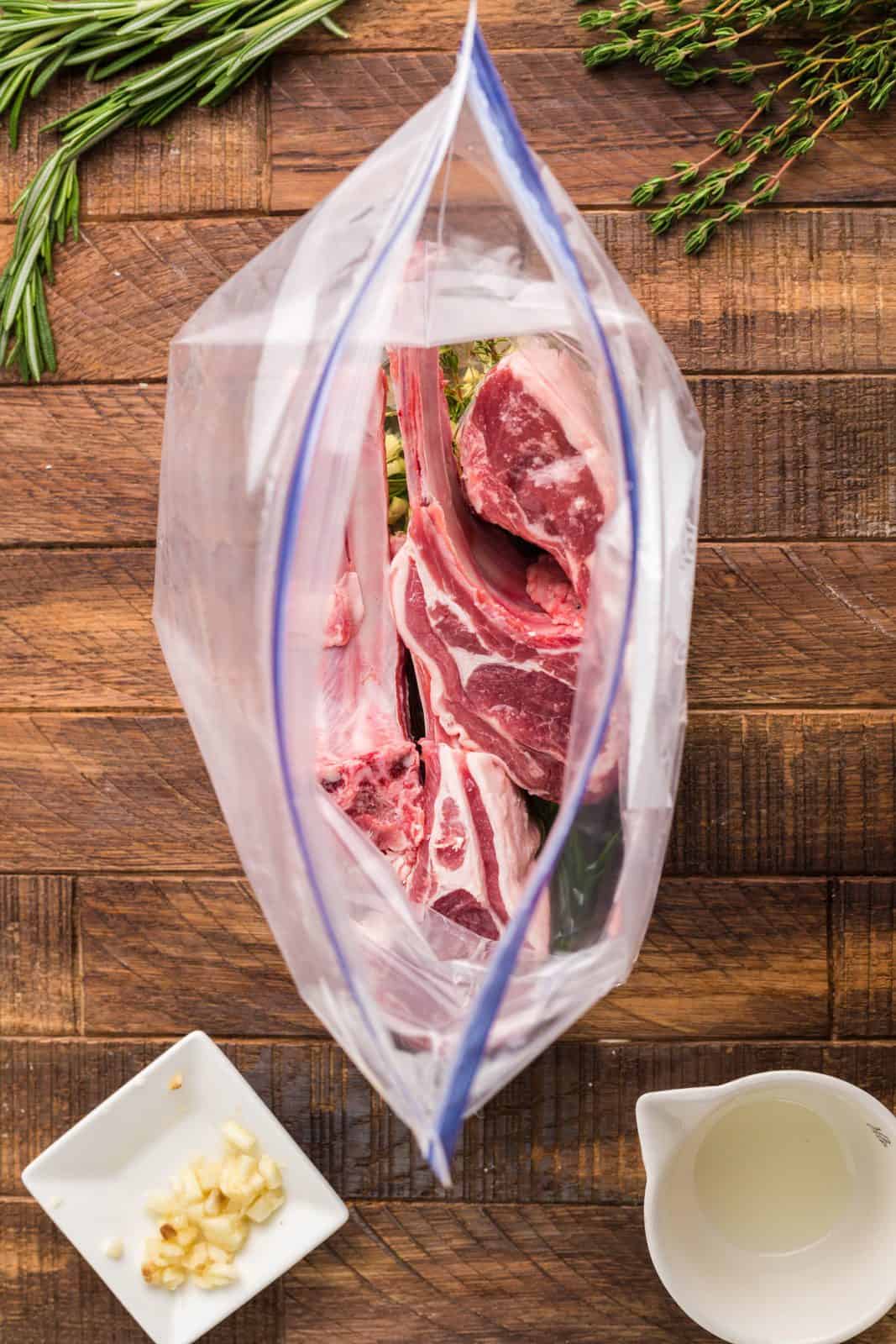 Sliced lamb chops added into ziptop bag.