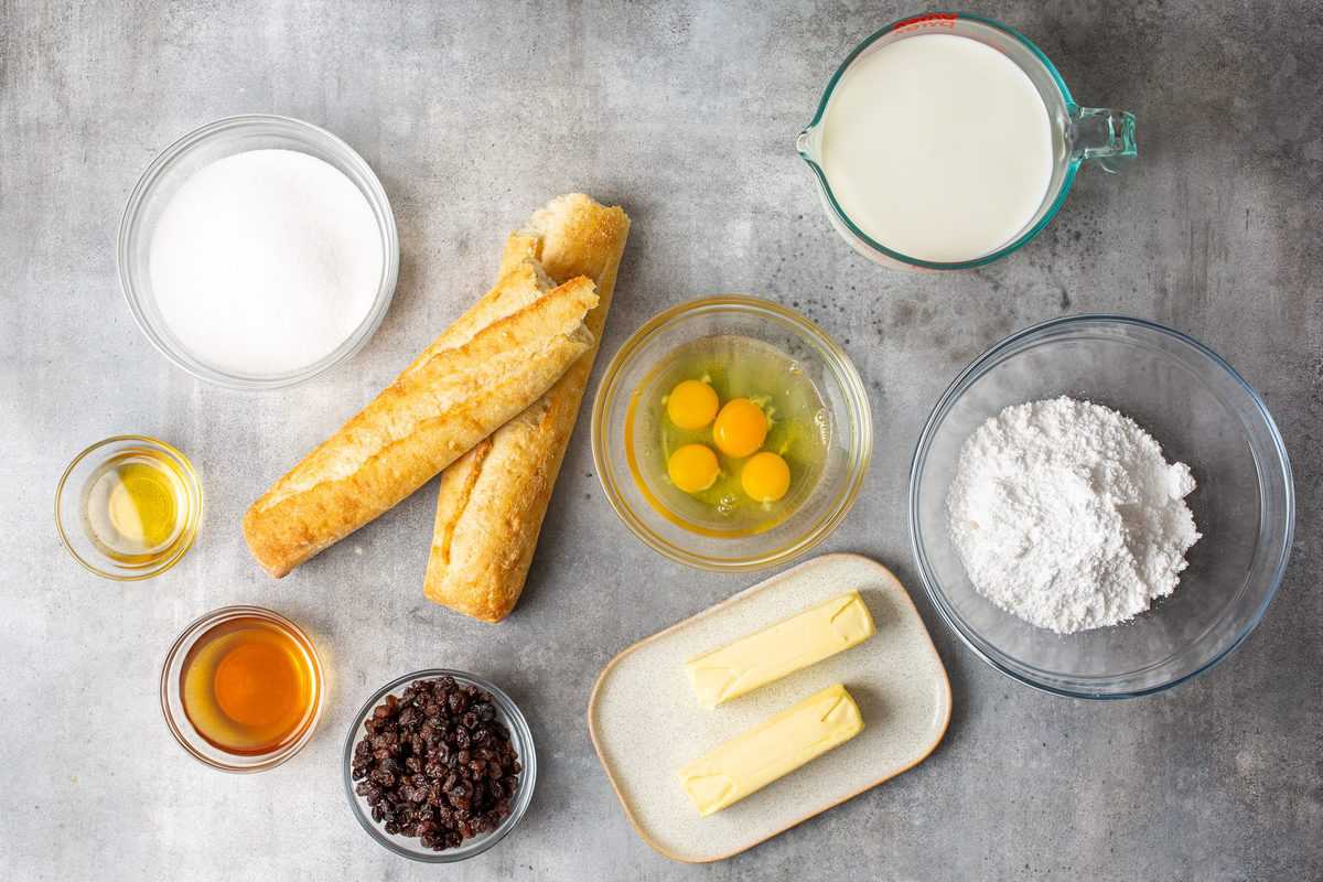 Ingredients needed: butter, french bread, raisins, milk, eggs, sugar, vanilla extract, dark rum or whisky and powdered sugar.